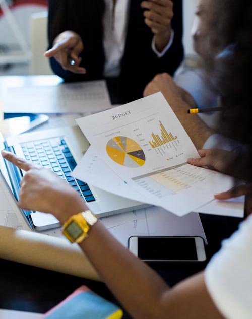 Business people working on budget in office